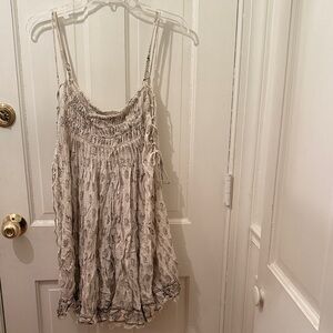 FREE PEOPLE guazy mini dress with tied sides & raw hem with socking at top, sz S